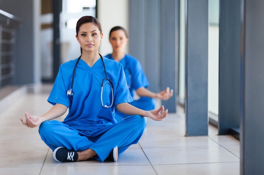 Healthcare professionals practising yoga